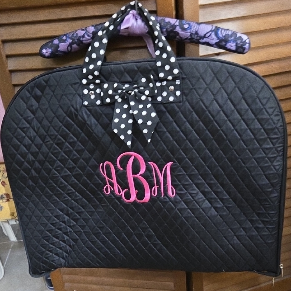 Elegant Black Quilted Travel Bag with Polka Dot Handles